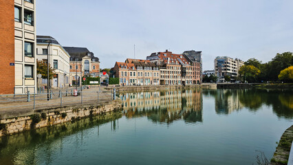 Scenic Reflection of Historic Buildings on a Tranquil Waterway at Le quai du Wault ( Le quai du...
