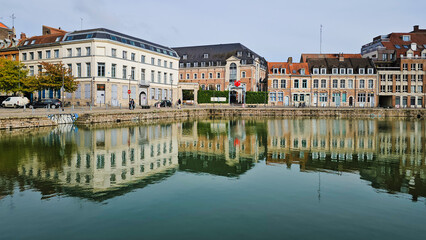 Scenic Reflection of Historic Buildings on a Tranquil Waterway at Le quai du Wault ( Le quai du Wault ) one of the two old ports of Lille, France