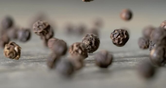 Peppercorns or black pepper spice. Super Macro Close Up. Shot on super slow motion camera 1000 fps.