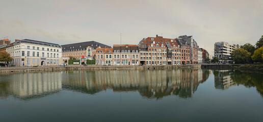 Scenic Reflection of Historic Buildings on a Tranquil Waterway at Le quai du Wault ( Le quai du Wault ) one of the two old ports of Lille, France