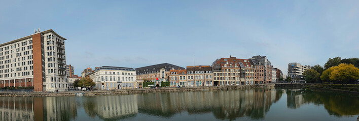 Scenic Reflection of Historic Buildings on a Tranquil Waterway at Le quai du Wault ( Le quai du Wault ) one of the two old ports of Lille, France