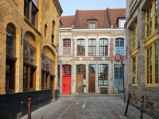 Fototapeta premium Vieux Lille Old town : Empty Narrow Cobblestone Street and Old Architectural Buildings in the Historic City Center, Northern France