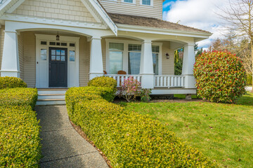 Entrance of grey painted luxury house in summer with stair steps and nice landscape in Vancouver,...