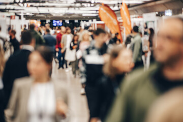 Abstract blurred people at exhibition hall of expo event trade show. Business convention show or...
