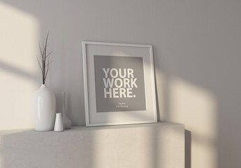 Square art poster frame mockup with passepartout standing in apartment