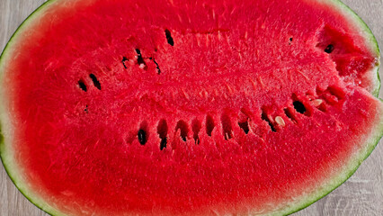Close-up of cut ripe juicy red watermelon with seeds