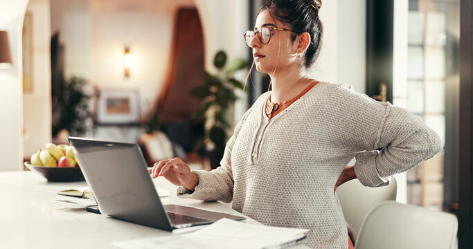 Remote work from home, back pain or woman with laptop, tension or pressure in lounge. Writer, person or journalist with computer, tired or burnout with fatigue, injury or overworked with poor posture