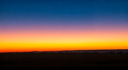 Obraz premium : A gradient sunset melting into the ocean waves.jpg