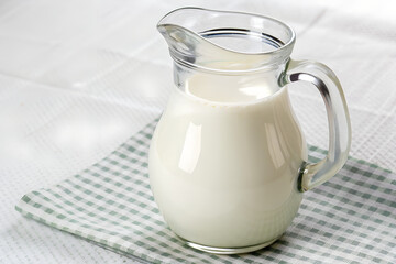 Glass jug of fresh milk isolated on transparent background