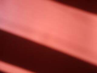 Red background with shadow stripes. Abstract colorful background with stripes
