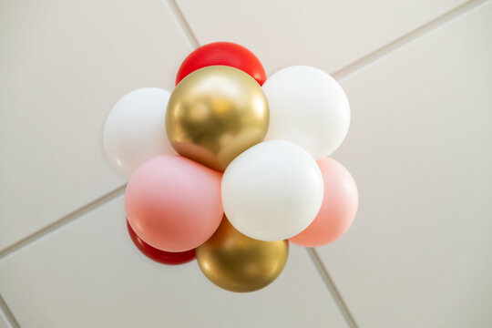 Colorful Party Balloons Against Drop Grid Ceiling - Festive Decor Photography