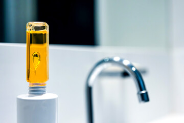 Drops inside a plastic bottle. Beautiful drops inside a yellow oily liquid.