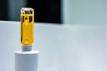 Drops inside a plastic bottle. Beautiful drops inside a yellow oily liquid.