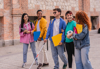 Blind university student walking with friends on campus