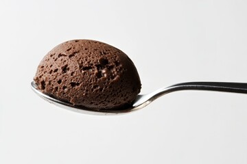 A spoonful of rich, dark chocolate mousse, creamy and decadent.