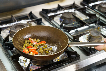 Sautéed Tomatoes and Capers in Frying Pan
