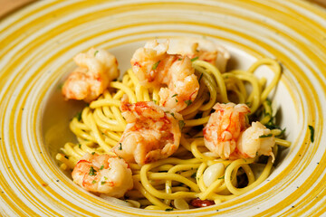 Shrimp pasta dish served on a wooden table