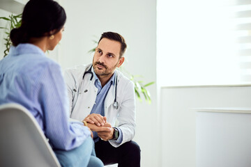 Doctor Consulting Patient During a Medical Appointment in a Clinic Setting