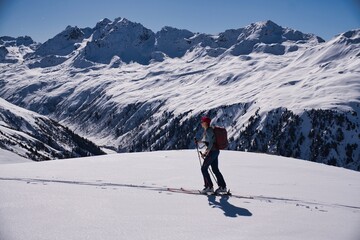 Madrisa Ski tour. From Klosters to Gargellen. Picture taken shortly before the Schlappiner Joch. Ski mountaineering in the Alps in beautiful mountain weather and sunshine. High quality photo.