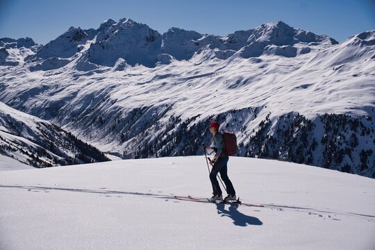 Madrisa Ski tour. From Klosters to Gargellen. Picture taken shortly before the Schlappiner Joch. Ski mountaineering in the Alps in beautiful mountain weather and sunshine. High quality photo.