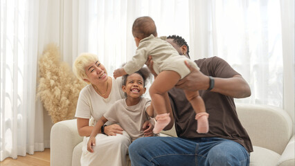 Obraz premium Parents and children relax during their holiday at home