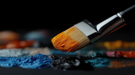 Fototapeta premium Paintbrush poised over vibrant pigments