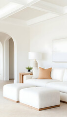 Bright, airy living room with white sectional sofa, ottomans, and beige accent pillow