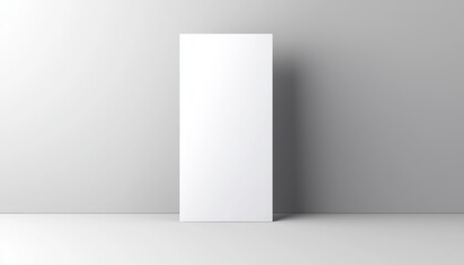 A minimalistic, rectangular white panel stands against a light gray wall, embodying simplicity and modern design.