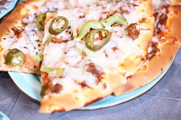 A close-up view of a delicious-looking pizza on a plate, perfect for food photography or advertising.