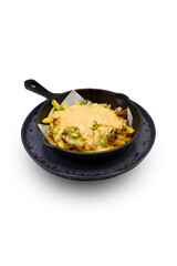 Loaded fries with cheese and jalapenos in a cast iron dish