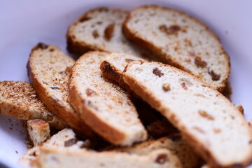 Freshly sliced bread served in a clean white bowl, ready for use.