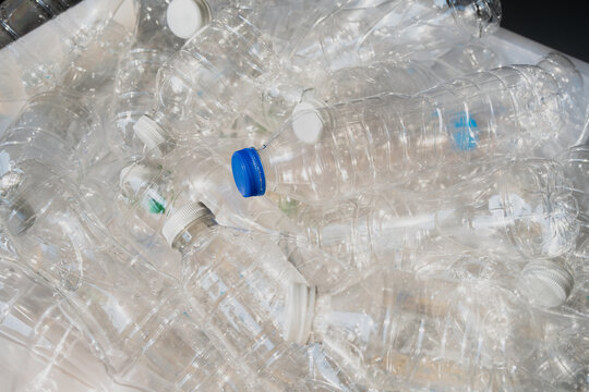 Close-up plastic water bottles with caps for recycling