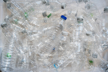 Close-up plastic water bottles with caps for recycling