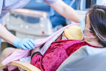 Nurse Covering Premature Baby in NICU