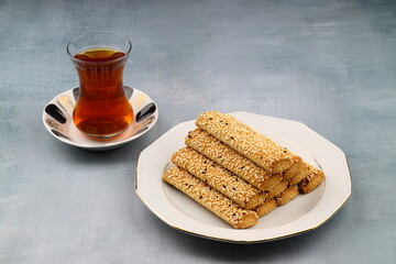 A plate of cookies is sitting on the table.