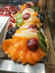 Delicious fruit tarts displayed in bakery window in Mnisek pod brdy
