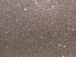 Silver sparkle background. Silver glitter background. Metallic gray glimmer. Abstract twinkle texture. Glitter surface. Glimmer layout. Holiday layout. Diamond luxury surface. Celebration background.