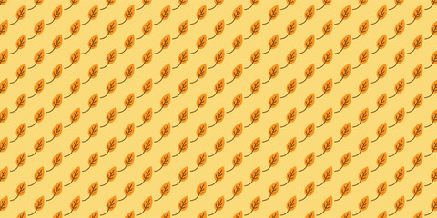 Seamless Pattern of Orange Leaves on a Soft Yellow Background