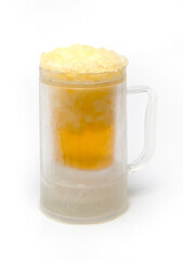 Chilled beer glass and beer in ice cubes