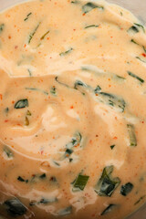 Creamy Spiced Sauce with Fresh Herbs and Seasonings

