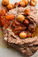 Close-Up of Gourmet Pâté with Caramelized Hazelnuts and Fruit Chutney

