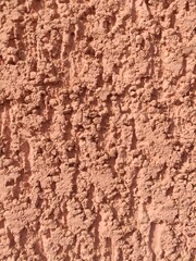 Rough orange stucco wall surface for backgrounds and handmade style blog visuals