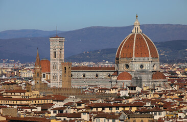 Florence cathedral in ITALY with bell tower of Giotto and dome of Brunelleschi and the hills in the background