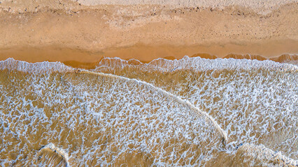 Aerial View of Waves Lapping on Golden Sandy Shore in La Guajira, Colombia