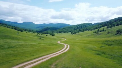 Serene mountain valley road winding through verdant fields