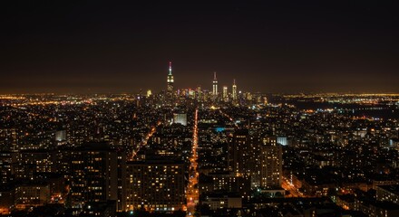 Obraz premium Illuminated cityscape panorama at night, showcasing a vibrant metropolis