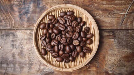 Fototapeta premium Top view a bowl of roasted coffee beans on a wooden table.