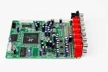 A close-up of the processor microchip surrounded by other electrical components on a green circuit...