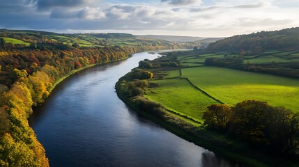 Autumnal river meanders through picturesque countryside