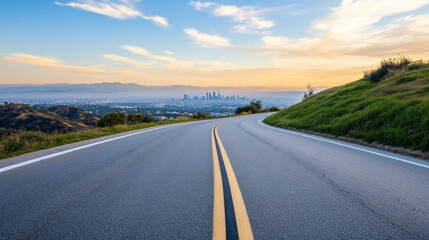 Fototapeta premium A winding road gracefully descends towards the sprawling skyline of Los Angeles, illuminated by the golden hues of sunset. Lush greenery lines the roadside, creating a tranquil atmosphere